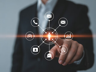 Businessman interacting with digital interface icons for communication and data analysis in a professional setting with technology