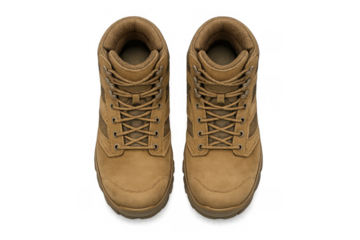 Top view of tan hiking boots on gray background for outdoor adventure design
