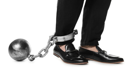 Businessman with metal ball and chain on his leg against white background, closeup
