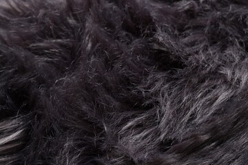 Obraz premium Texture of black fluffy fabric as background, closeup