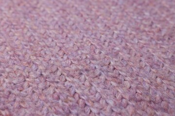 Texture of purple knitted fabric as background, closeup