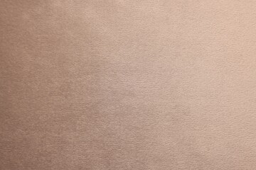 Fototapeta premium Texture of beige fabric as background, top view
