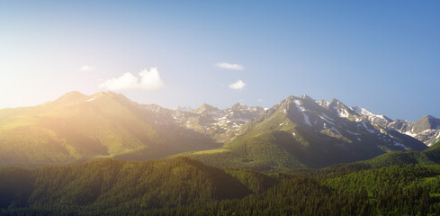 Nature landscape of sunlight mountain peak panorama and forest valley.