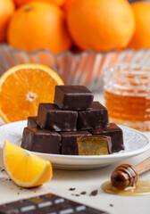 Homemade chocolates (candy) made of chocolate and orange jelly with honey. Healthy and delicious dessert. Selective focus
