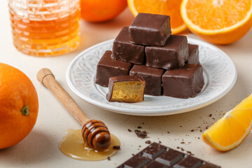 Homemade chocolates (candy) made of chocolate and orange jelly with honey. Healthy and delicious dessert. Selective focus