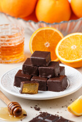 Homemade chocolates (candy) made of chocolate and orange jelly with honey. Healthy and delicious dessert. Selective focus