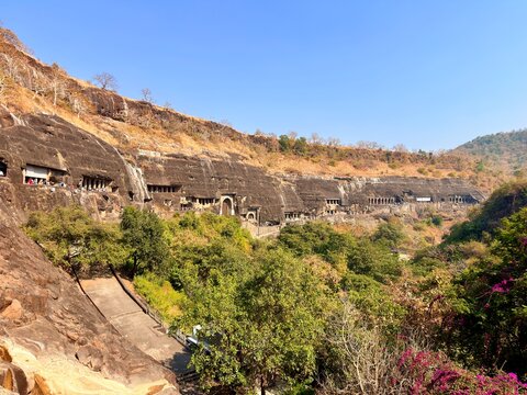 Panoramic view of the Ajanta Caves carved along a river valley, UNESCO World Heritage site in Maharashtra, India
