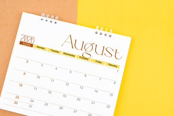 August 2026 desk calendar on brown and yellow, Planning for business.