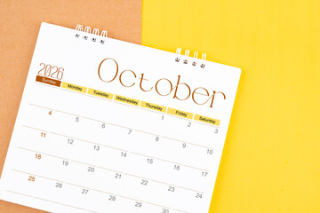 October 2026 desk calendar on brown and yellow, Planning for business.