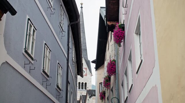 Urban street landscape in Hallstatt Austria. Beautiful houses narrow tourist historical streets with alpine architecture.