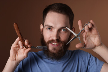 Man with barber's tools on brown background