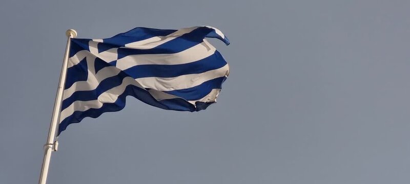 greek flag greece waving in the wind and sun
