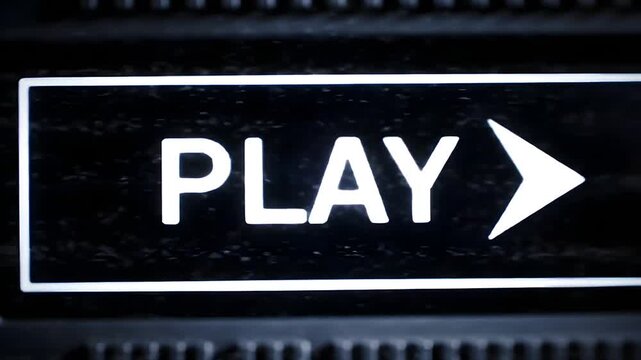 Close-up view of a play button on a digital interface with a prominent arrow icon