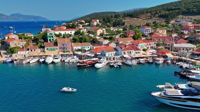 Aerial drone flying over picturesque Fiskardo harbor in Kefalonia...