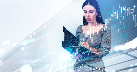 Woman in business attire studies document with financial charts overlaid, modern creative style, digital data background, concept of business strategy
