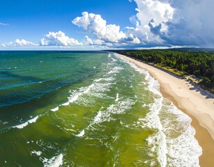 Aerial view of a stunning coastline, featuring an expansive sandy beach meeting the foamy ocean under a vibrant, cloudy sky