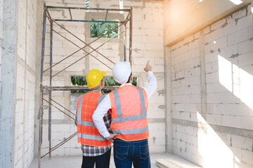 Client and Contractor discussing plan to renovation house.