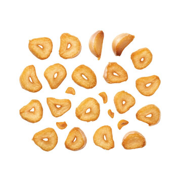 Crispy fried garlic flakes and slices floating On Transparent Background