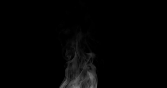 White isolated steam rises in graceful curves on a black background in slow motion. This steam trickle is perfect for overlay use with various blending modes, hot drink or food steam concepts.