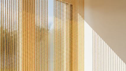 Bamboo beaded curtains in sunny yellow hues creating a bright and cheerful atmosphere in any room