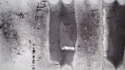 Blank grained film strip texture background with heavy grain, dust and light leak. Old expired moldy photographic film scan.