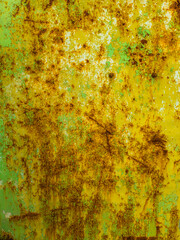 Rusty flat steel surface texture with scratched yellow paint leftovers
