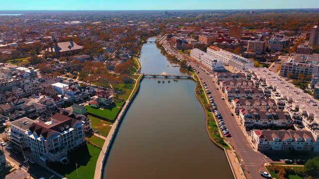 Aerial Fly over river and stream of Asbury Park, New Jersey small town