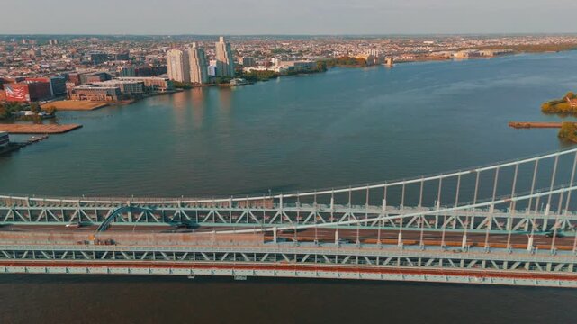 Aerial Drone of Bridge - Philadelphia Ben Franklin Bridge dolly with traffic and Delaware River