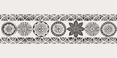 Intricate black and white floral and geometric pattern repeating as a decorative border © Ankan