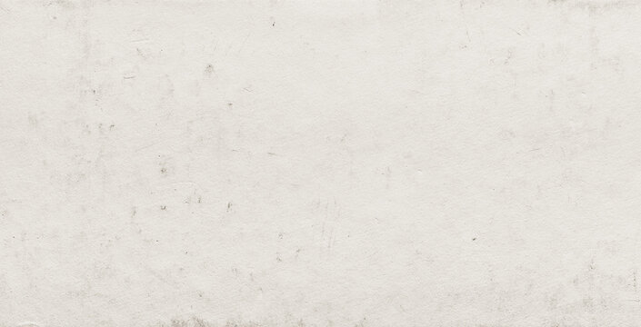 Grunge beige colored paper background with dirt scuffs and scratches