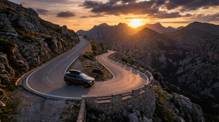 Car driving on winding mountain road at sunset in scenic landscape  