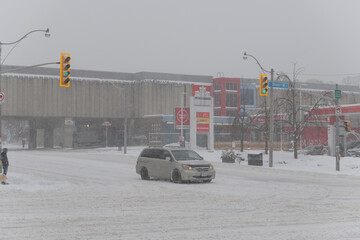 Obraz premium looking northeast to Keele Station of Line 2 from Bloor St W during a snow storm on 2026-01-15 in Toronto