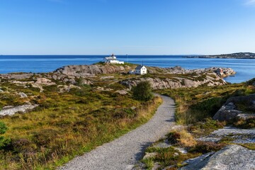 view of the historic Stavneset Lighthouse on the entrance of the Bremsnesfjorden Fjord near Kristiansund