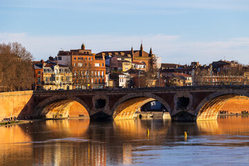 Naklejka premium Panorama of Pont Neuf over the Garonne River in winter, Notre-Dame de la Dalbade Church and the Carmes district seen from Saint-Pierre Bridge in Toulouse