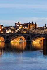 Obraz premium Panorama of Pont Neuf over the Garonne River in winter, Notre-Dame de la Dalbade Church and the Carmes district seen from Saint-Pierre Bridge in Toulouse