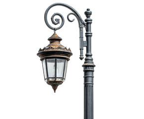 Old ornate black cast iron lamppost with a hanging lantern showing signs of rust and weathering, featuring intricate scrollwork and detailed vintage design elements