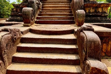Ancient Korawakgala stone balustrades at Buddhist temple entrance in Sri Lanka
