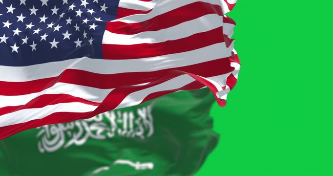Saudi Arabian and American flags waving isolated on green background