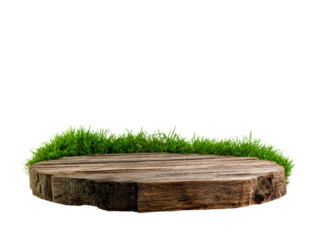 Rustic round wooden display podium with a weathered texture and a ring of fresh green grass is shown from a low angle perspective for product presentation
