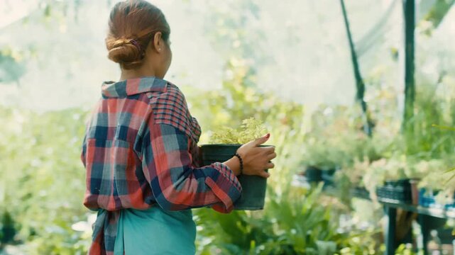 Woman Gardening in a Greenhouse