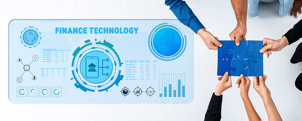 A diverse group collaborates on finance technology, engaging with digital data visuals and problem-solving elements, promoting teamwork and innovative solutions. Trope