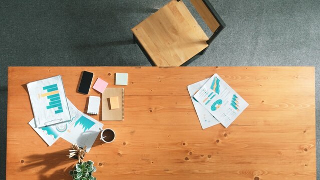 Business man working on laptop and document with data analysis while talking phone and brainstorming about business strategy. Manager calling colleague while writing idea on sticky notes. Convocation. - Powered by Adobe