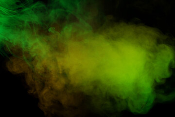 Yellow and green steam on a black background.