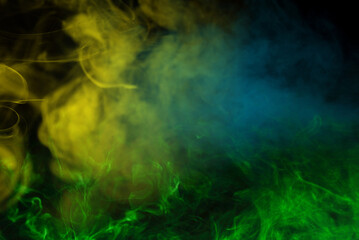 Obraz premium Yellow steam on a black background.