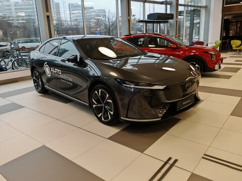 Prague,Czech Republic-14.01.2026: Mazda 6e electric vehicle displayed at an exhibition inside a shopping mall, presenting modern automotive design, electric mobility and brand promotion in a public 