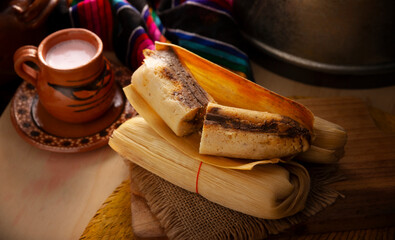 Tamales. Traditional dish typical of Mexico and some Latin American countries. Corn dough wrapped in corn leaves. The tamales are steamed.