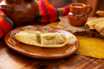 Tamales. Traditional dish typical of Mexico and some Latin American countries. Corn dough wrapped in corn leaves. The tamales are steamed.