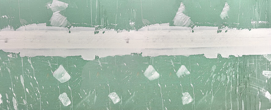 Drywall greenboard covered with joint compound mudding texture