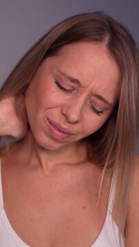 Young blonde woman scratching back of head with uncomfortable expression. Scalp irritation, itching skin, seborrheic dermatitis, dandruff, skin problem, illness, disease concept, healthcare