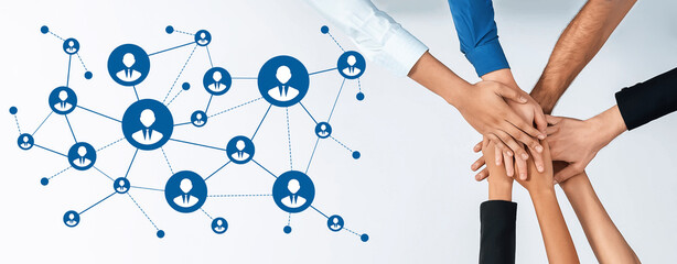 Hands unite in a display of teamwork and collaboration, representing the essence of networking and building professional connections in a dynamic business environment. Amity